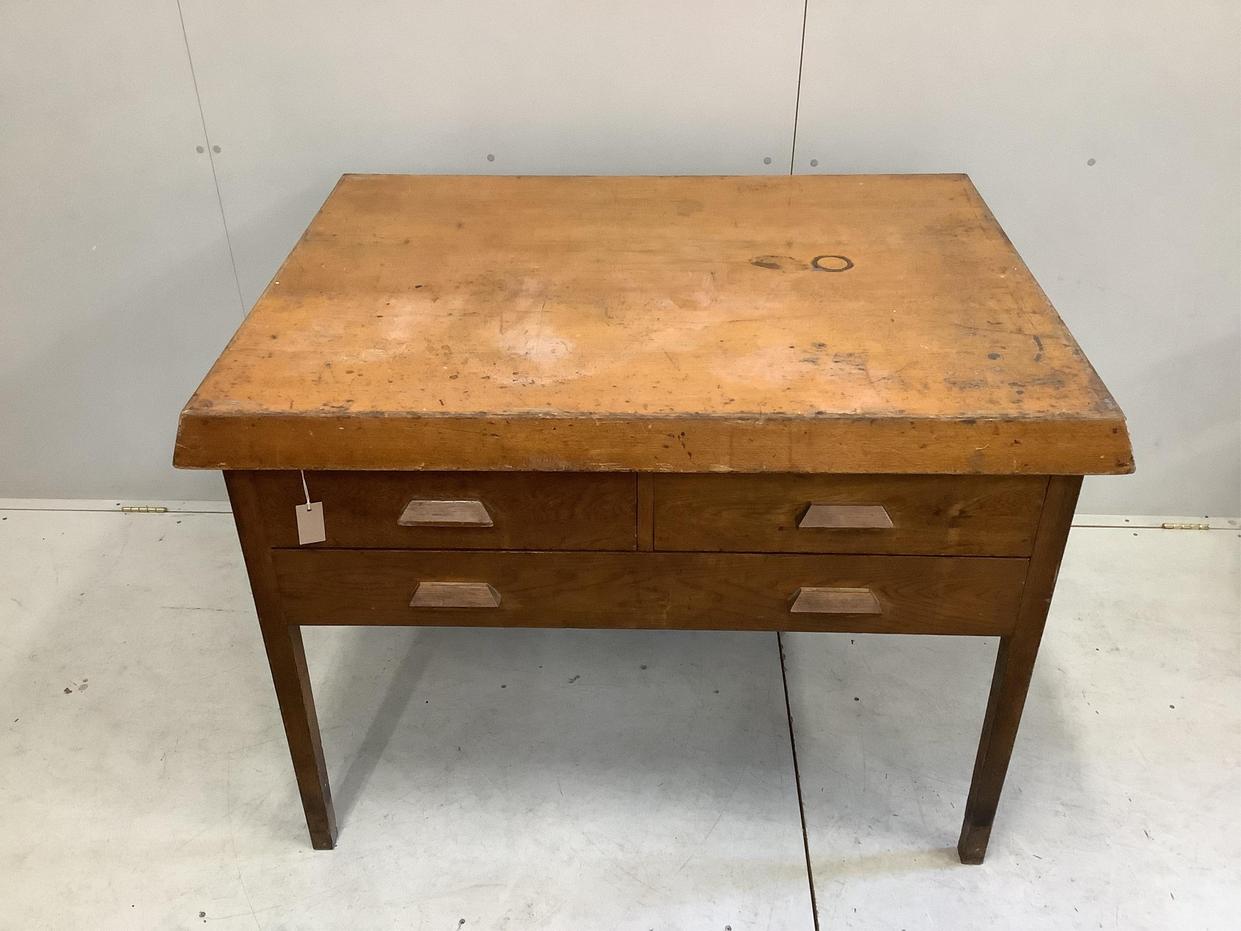 An early 20th century Scandinavian oak three drawer plan chest, width 125cm, depth 94cm, height 92cm. Condition - fair